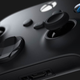 A very close-up view shows an Xbox Series X/S controller.